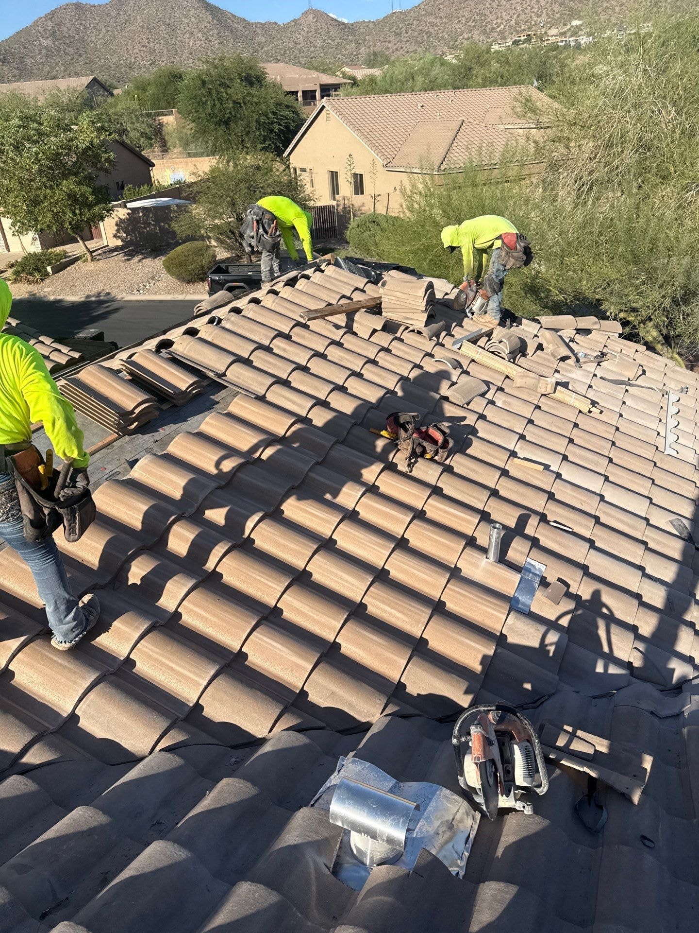 APM Builders crew installing tile roof on Arizona home