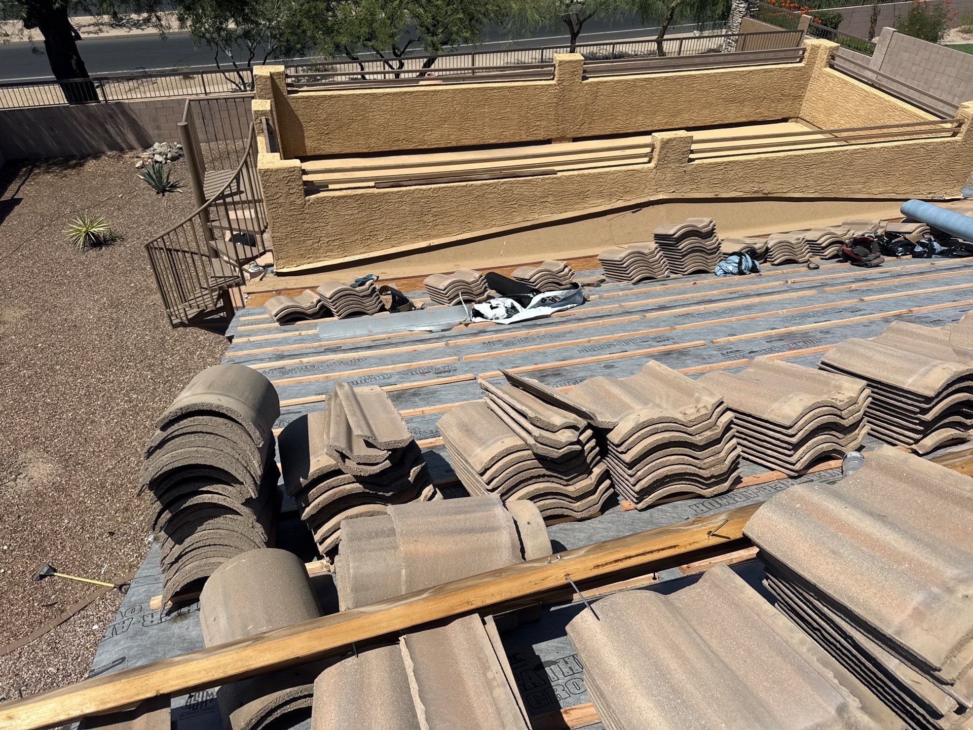 Tile materials staged on roof deck during re-roof project