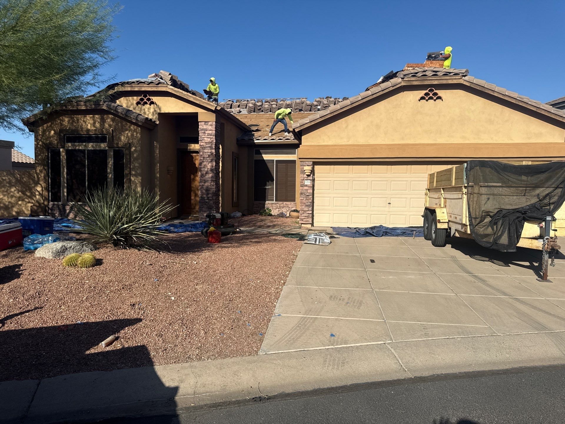 APM Builders crew completing tile roof replacement