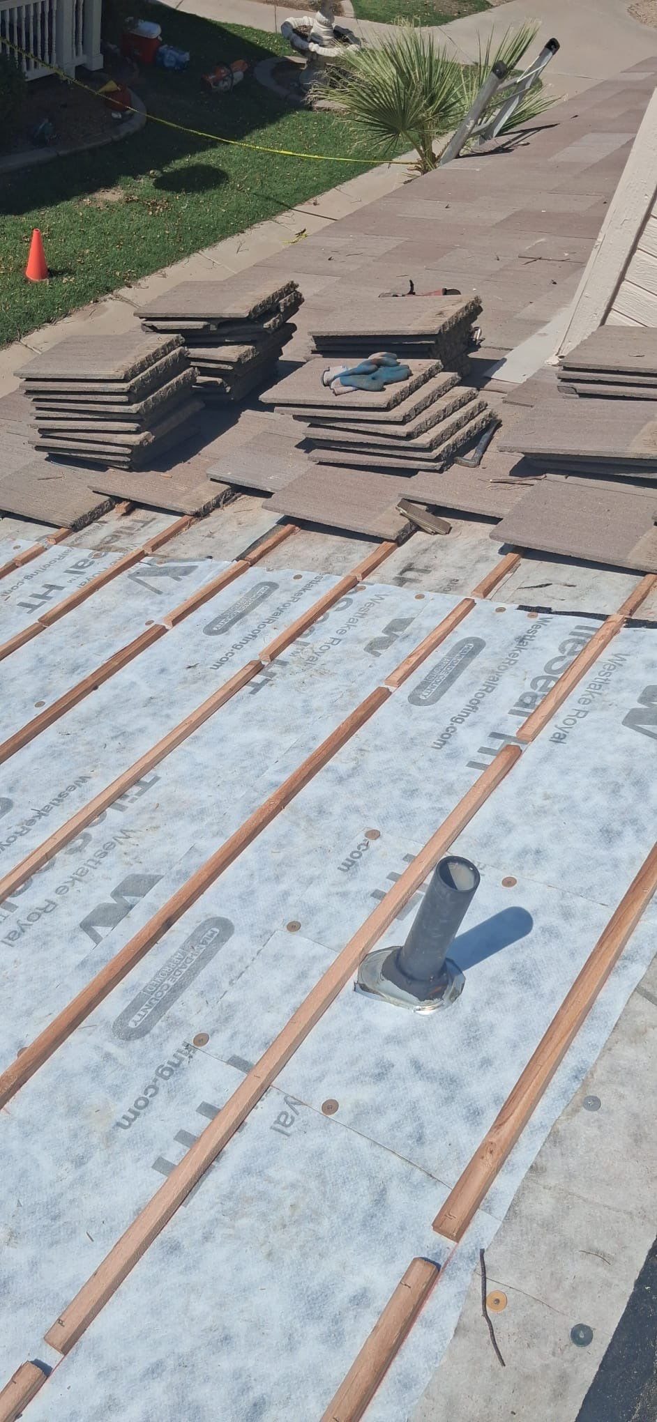 Tile roof repair with new underlayment and battens